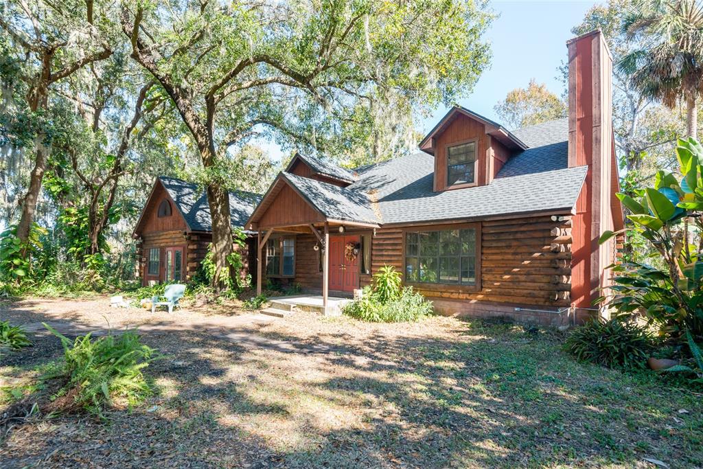 2641 McIntosh Road Dover, FL 33527 - Photo 42 of 58 a front view of a house with a yard and garage