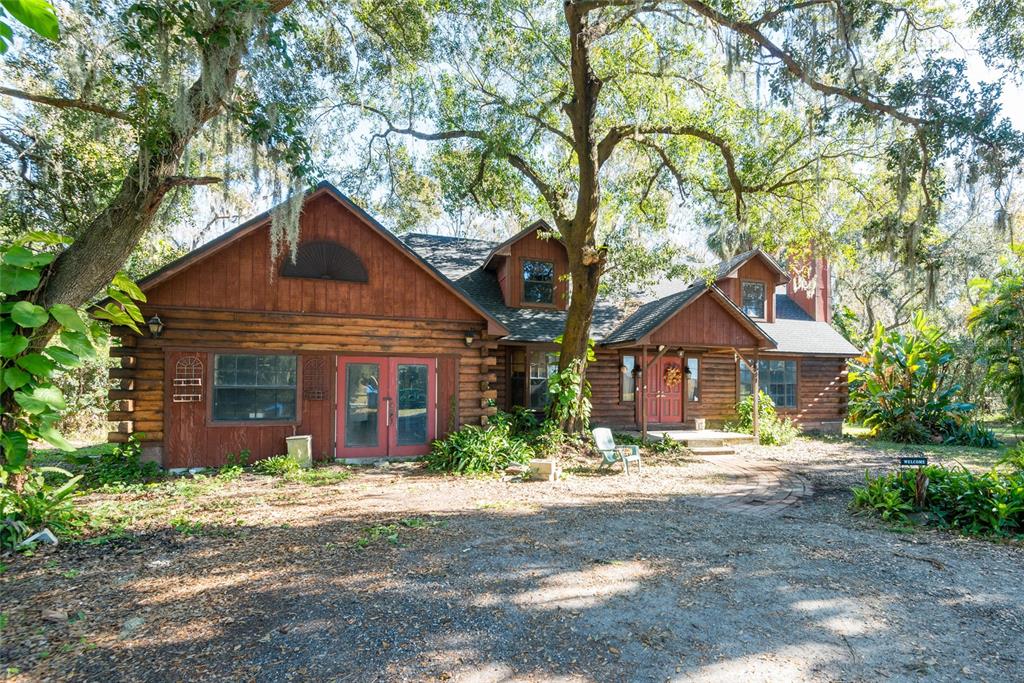 2641 McIntosh Road Dover, FL 33527 - Photo 43 of 58 a front view of a house with a yard and garage