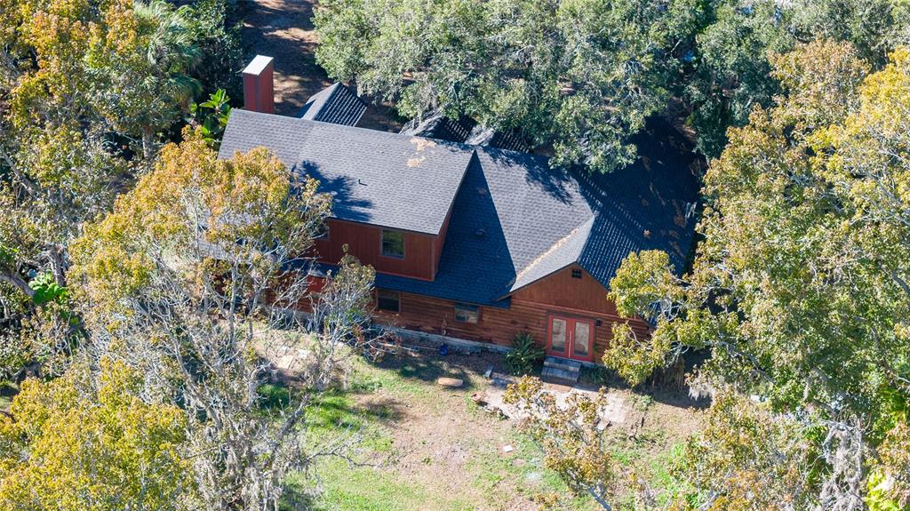 2641 McIntosh Road Dover, FL 33527 - Photo 49 of 58 a view of a house with a yard