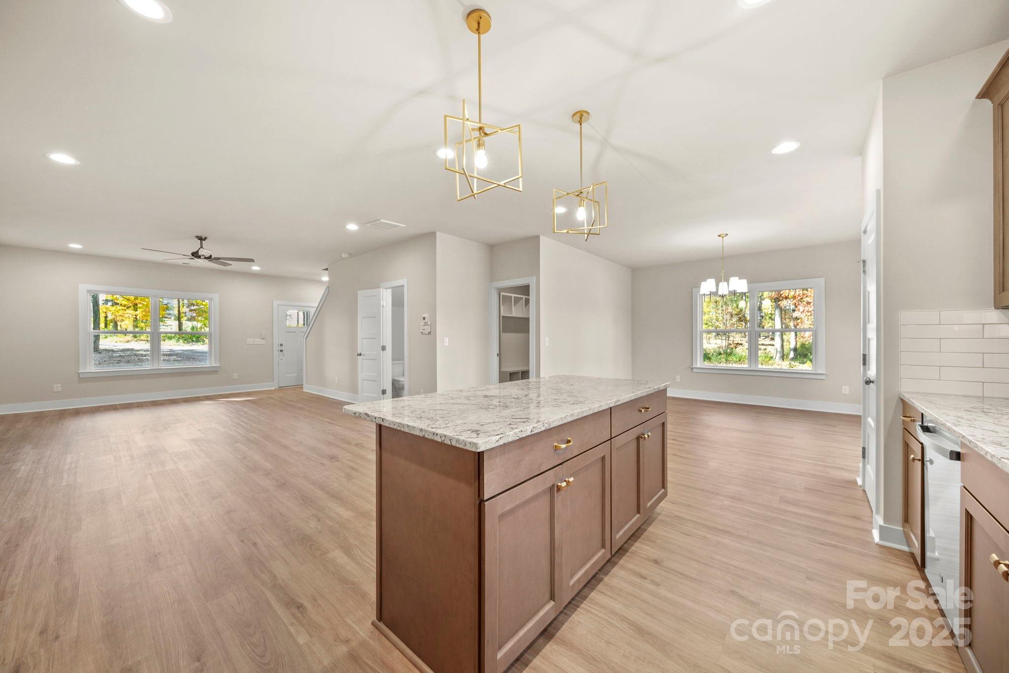 2601 Plyler Mill Road Monroe, NC 28112 - Photo 11 of 23 a open kitchen with a sink a window and stainless steel appliances