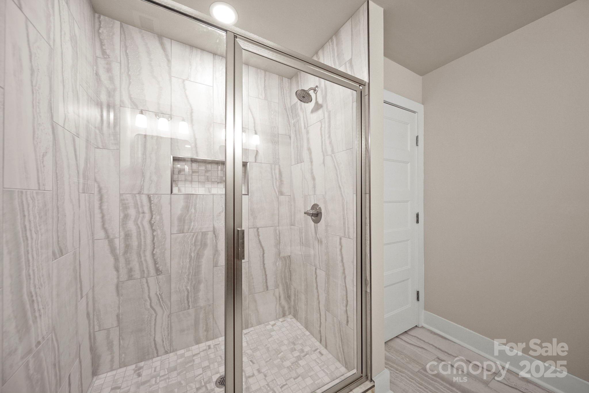 2601 Plyler Mill Road Monroe, NC 28112 - Photo 20 of 23 a bathroom with a shower and a sink