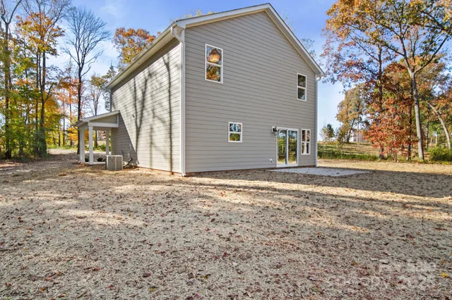 a view of a kitchen with a sink cabinets and wooden floor