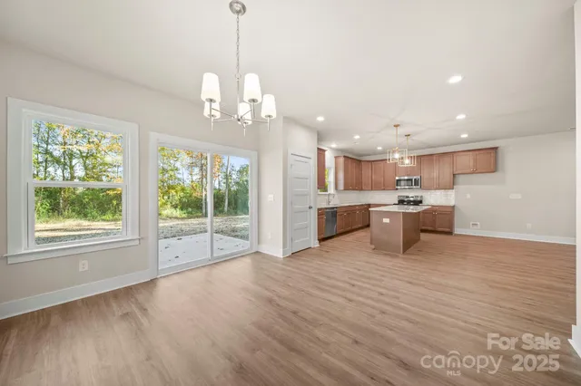 a view of a kitchen with a sink and a stove top oven