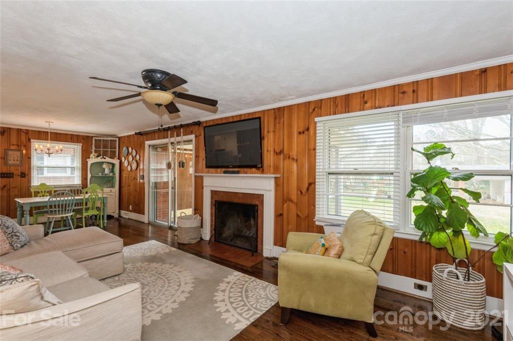 632 Scaleybark Road Charlotte, NC 28209 - Photo 16 of 36 a living room with furniture a fireplace and a potted plant