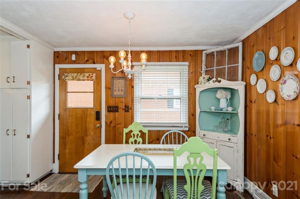 632 Scaleybark Road Charlotte, NC 28209 - Photo 18 of 36 a bedroom with a bed and wooden floor