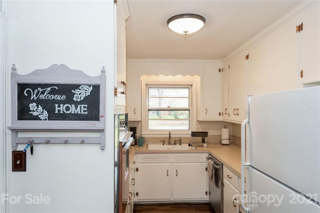 632 Scaleybark Road Charlotte, NC 28209 - Photo 20 of 36 a kitchen with a stove cabinets and a refrigerator