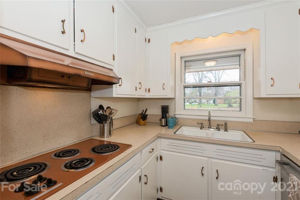 632 Scaleybark Road Charlotte, NC 28209 - Photo 22 of 36 a kitchen with a stove and a sink