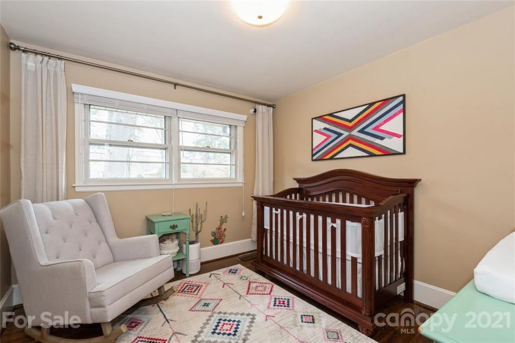 632 Scaleybark Road Charlotte, NC 28209 - Photo 27 of 36 a bedroom with furniture and a window
