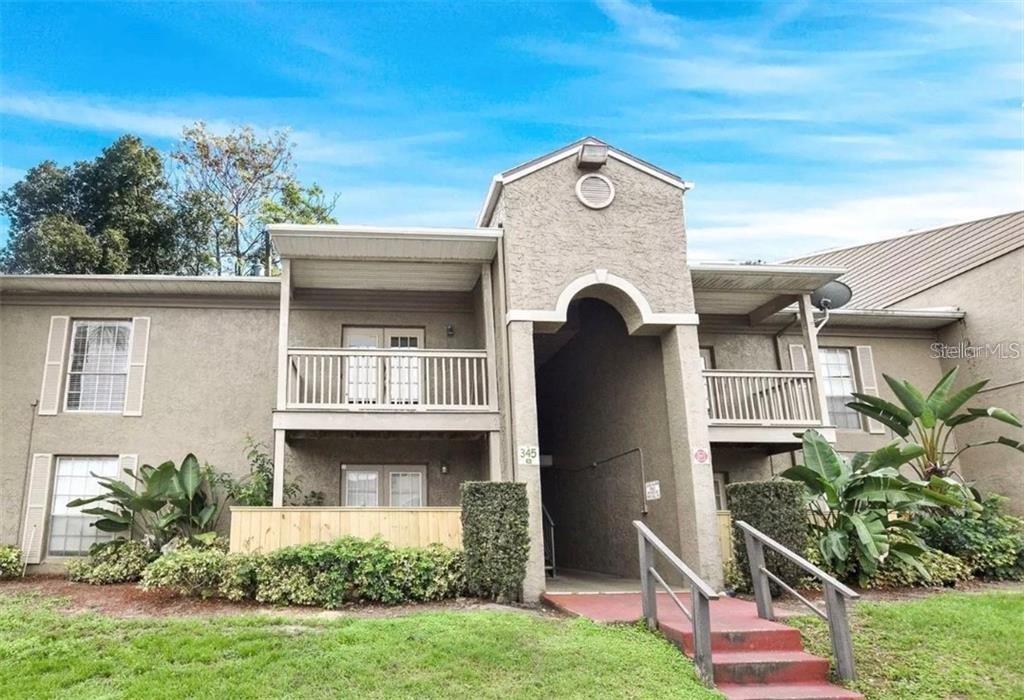 405 Wymore Road, Unit 204 Altamonte Springs, FL 32714 - Photo 1 of 1 a front view of a house with garden