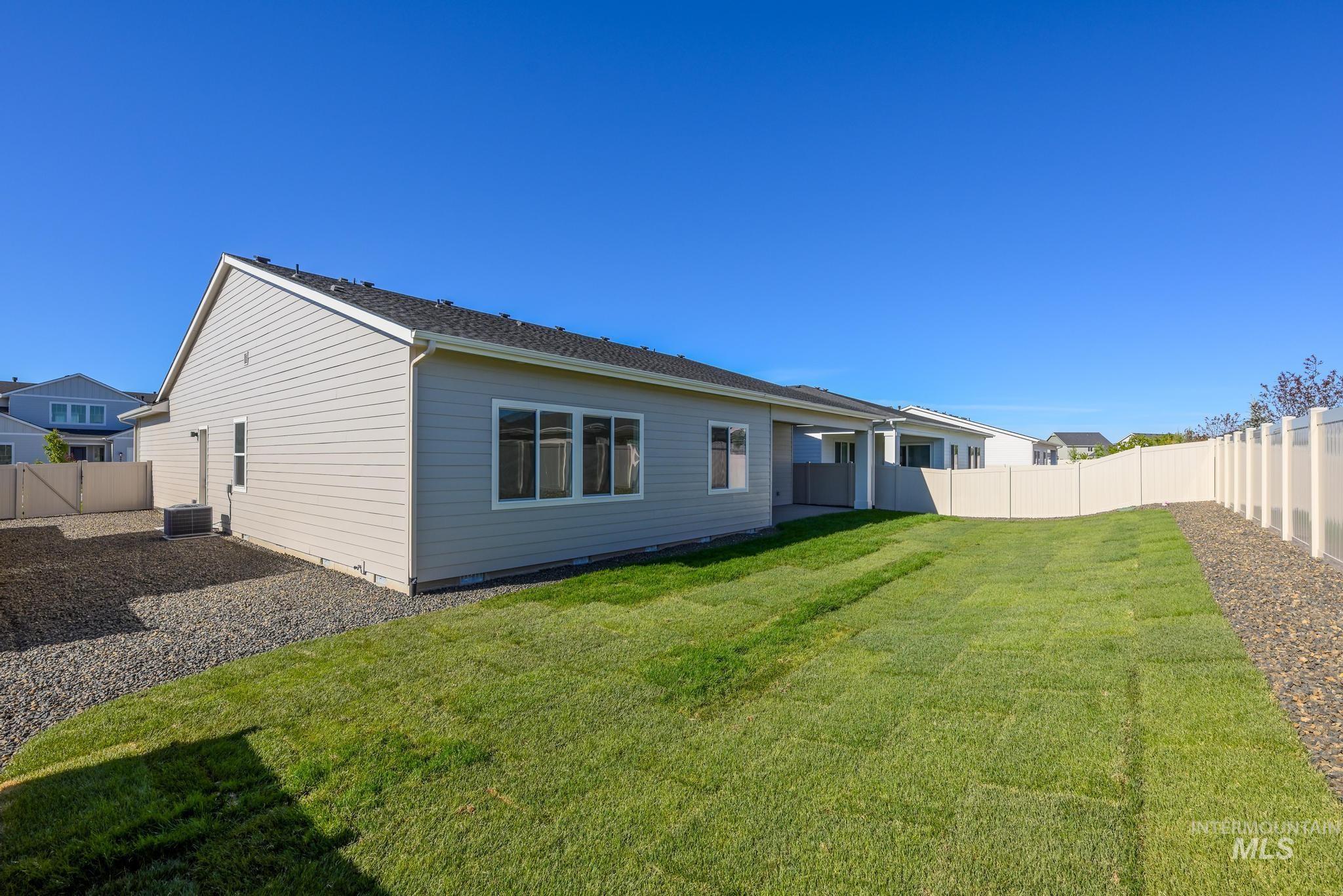 9074 West Moonglade Street Star, ID 83669 - Photo 30 of 40 Expansive rear yard with newly laid sod and gravel landscaping