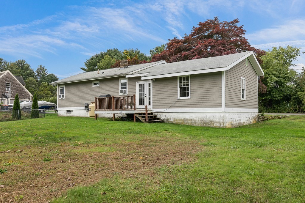 292 Cushman Road Rochester, MA 02770 - Photo 3 of 24 a view of a house with a backyard