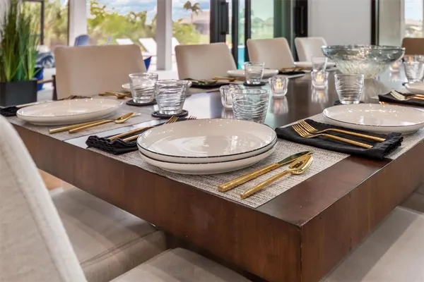 a bedroom with a large bed and a dresser