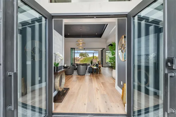 a view of living room with furniture and floor to ceiling window