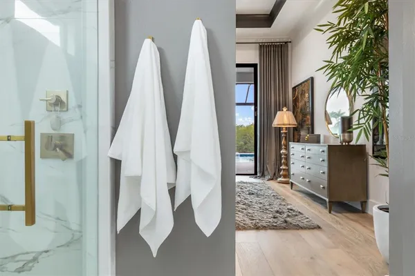 a bedroom with a bed and painting on the wall