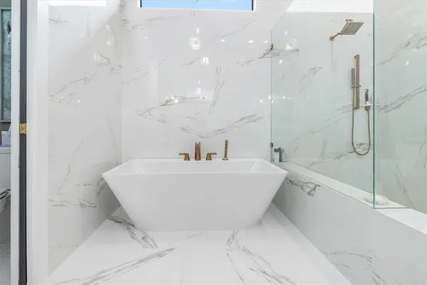 a bathroom with a shower and toilet