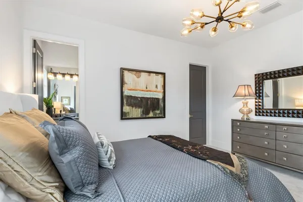 a bedroom with a bed and ceiling fan