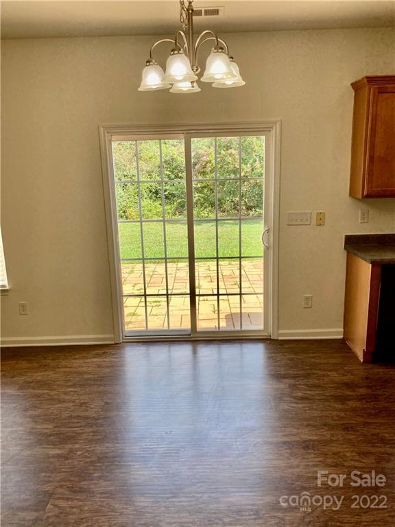 6432 Hermsley Road Charlotte, NC 28278 - Photo 11 of 32 a view of a room with wooden floor and a window