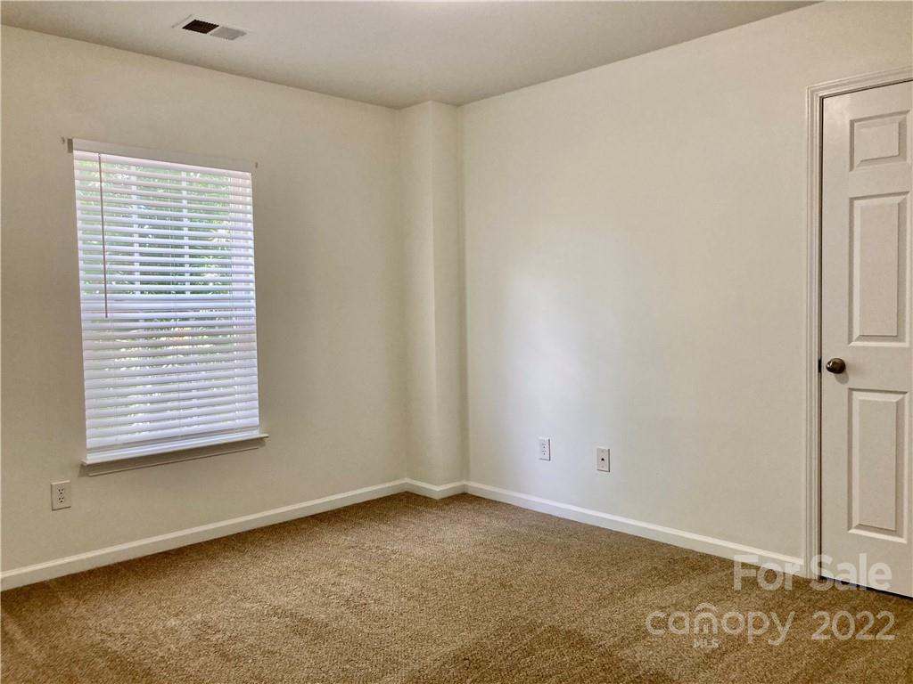 6432 Hermsley Road Charlotte, NC 28278 - Photo 17 of 32 an empty room with a window