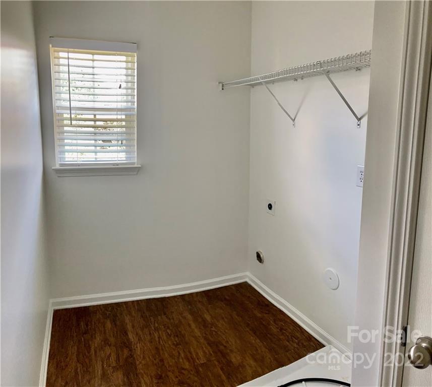 6432 Hermsley Road Charlotte, NC 28278 - Photo 18 of 32 a view of an empty room with wooden floor and a window