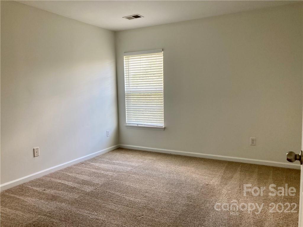 6432 Hermsley Road Charlotte, NC 28278 - Photo 22 of 32 an empty room with a window