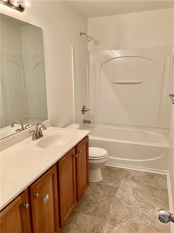 6432 Hermsley Road Charlotte, NC 28278 - Photo 24 of 32 a bathroom with a sink a toilet and a bathtub
