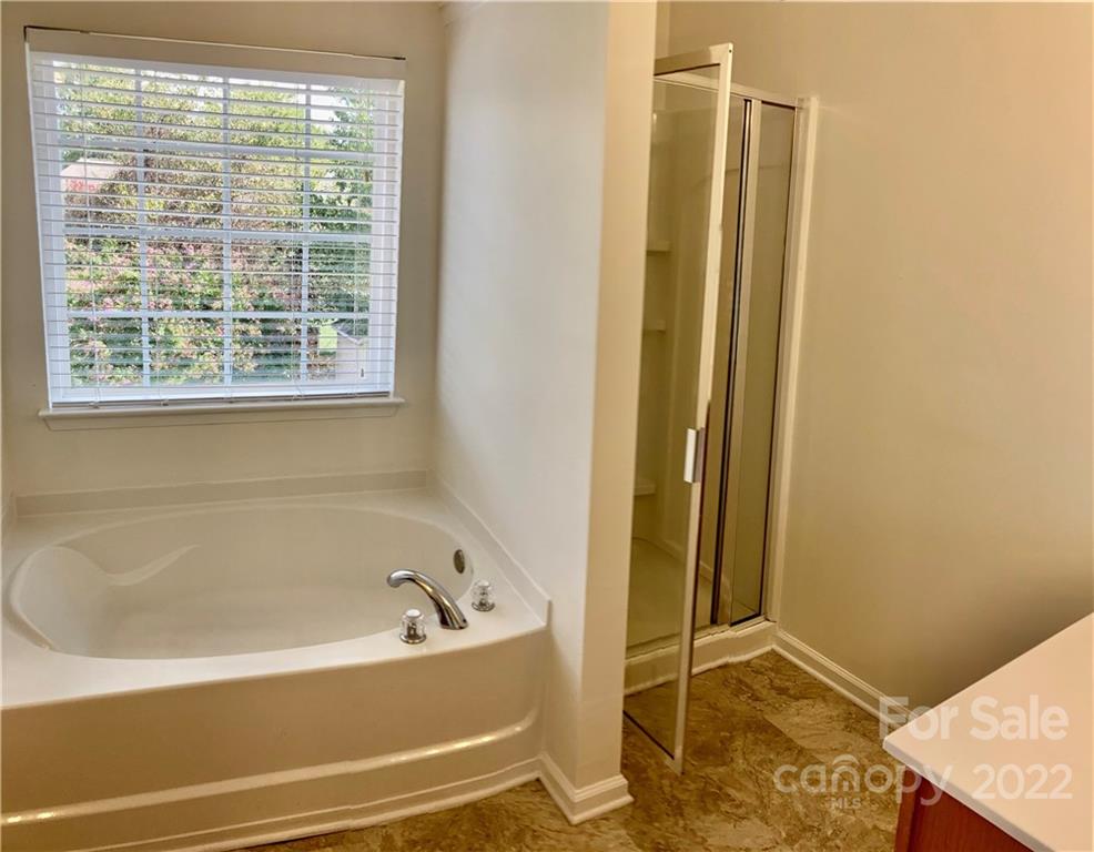 6432 Hermsley Road Charlotte, NC 28278 - Photo 28 of 32 a bathroom with a bathtub and shower
