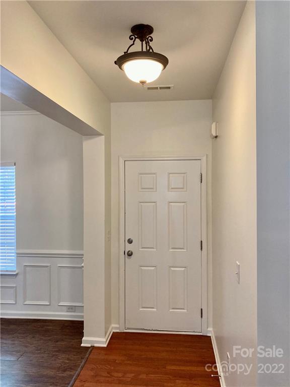 6432 Hermsley Road Charlotte, NC 28278 - Photo 3 of 32 a view of empty room with wooden floor and carpet