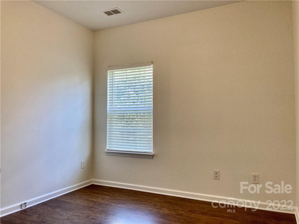 6432 Hermsley Road Charlotte, NC 28278 - Photo 8 of 32 a view of a small space with wooden floor and a window