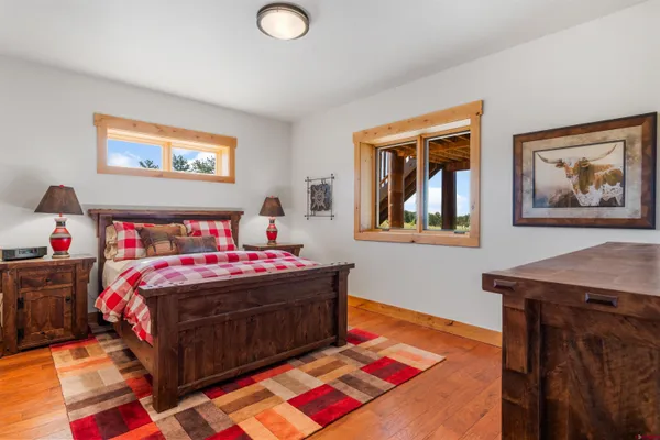 a bedroom with a bed and a dresser in it