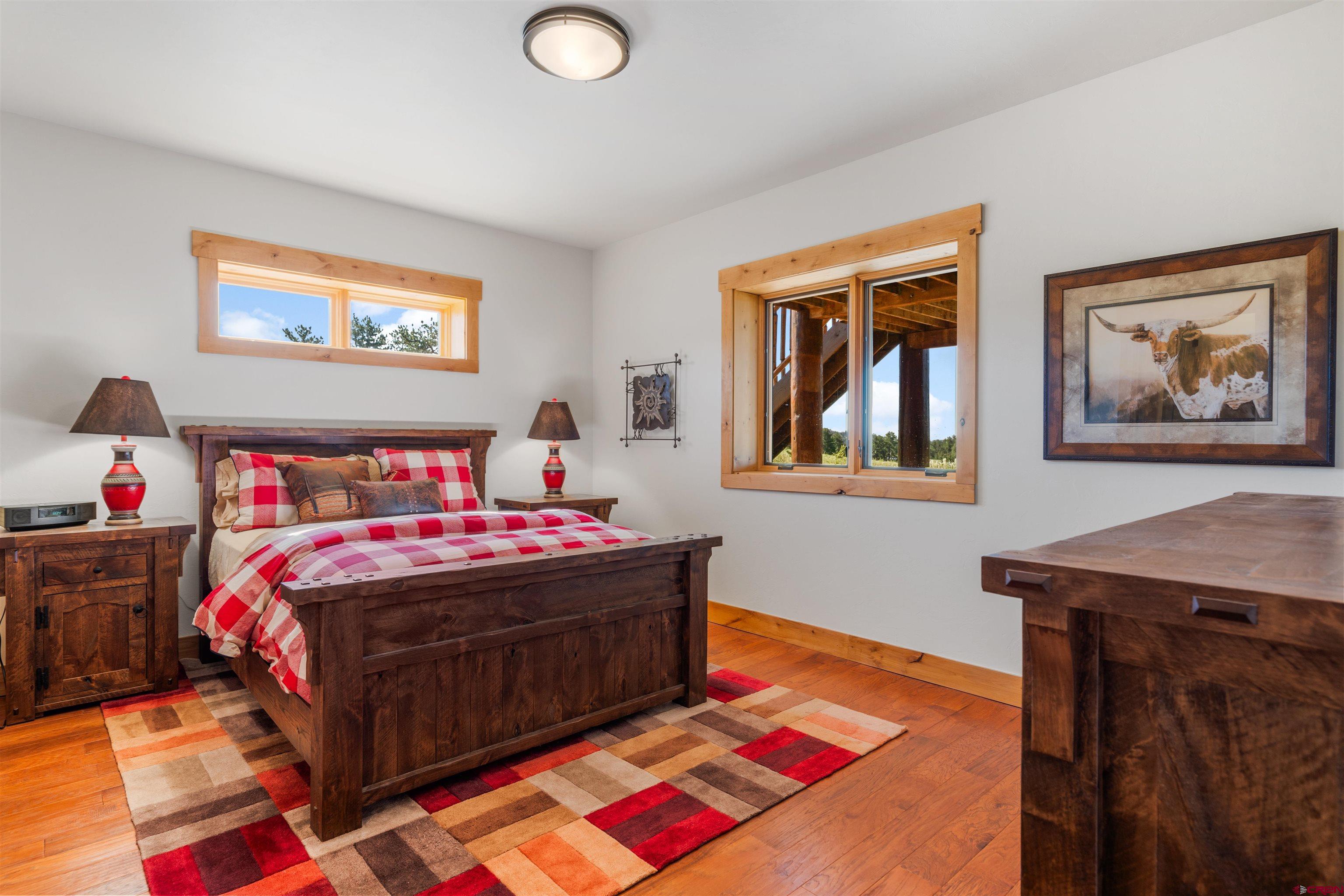 Inspirit Ranch Guffey, CO 80820 - Photo 18 of 35 a bedroom with a bed and a dresser in it