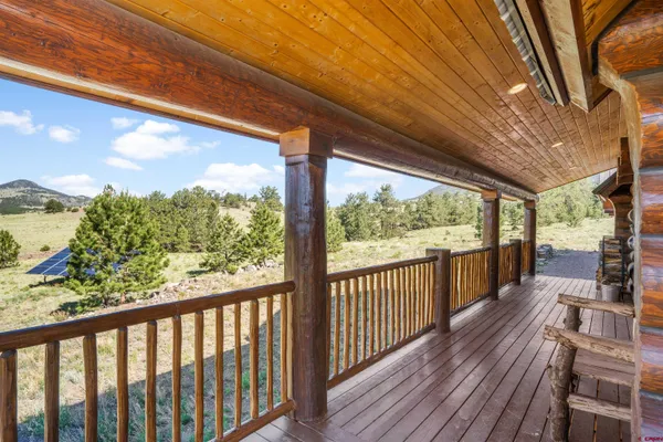 a view of a balcony with wooden floor