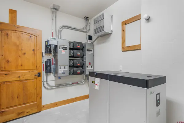 a kitchen with stainless steel appliances a refrigerator and cabinets