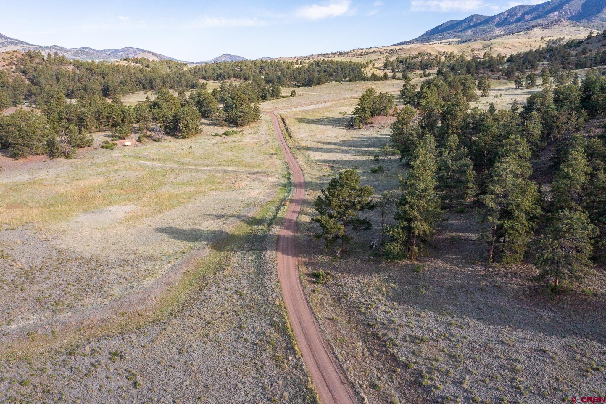 Inspirit Ranch Guffey, CO 80820 - Photo 31 of 35 a view of a yard with mountains in the background