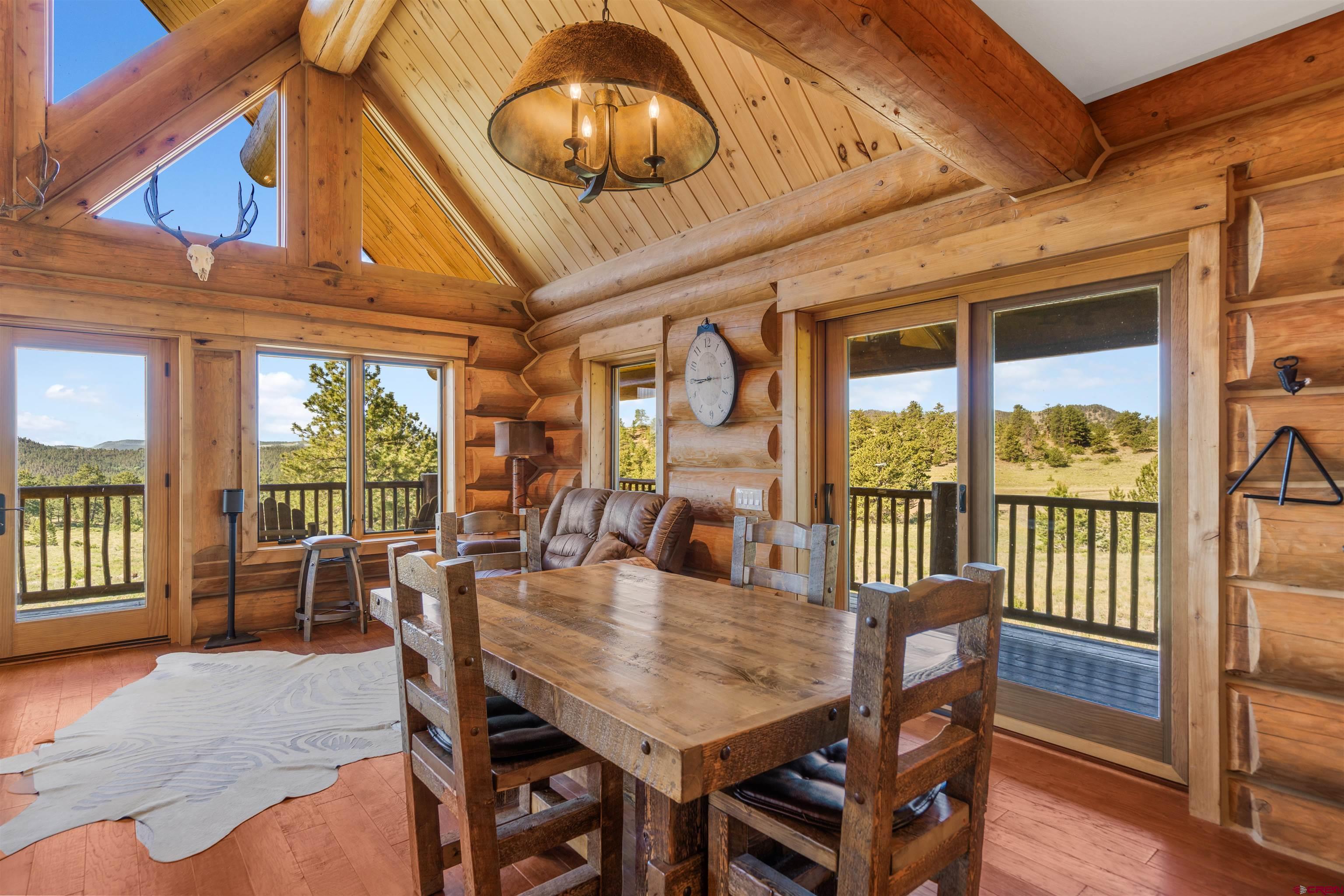 Inspirit Ranch Guffey, CO 80820 - Photo 6 of 35 a view of a dining room with furniture wooden floor and chandelier