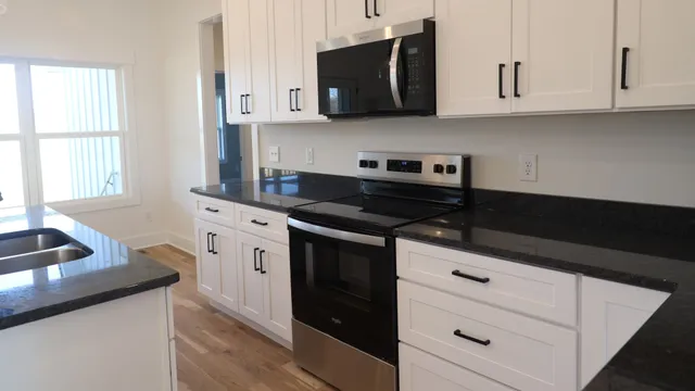 a close view of a sink a counter and in a kitchen