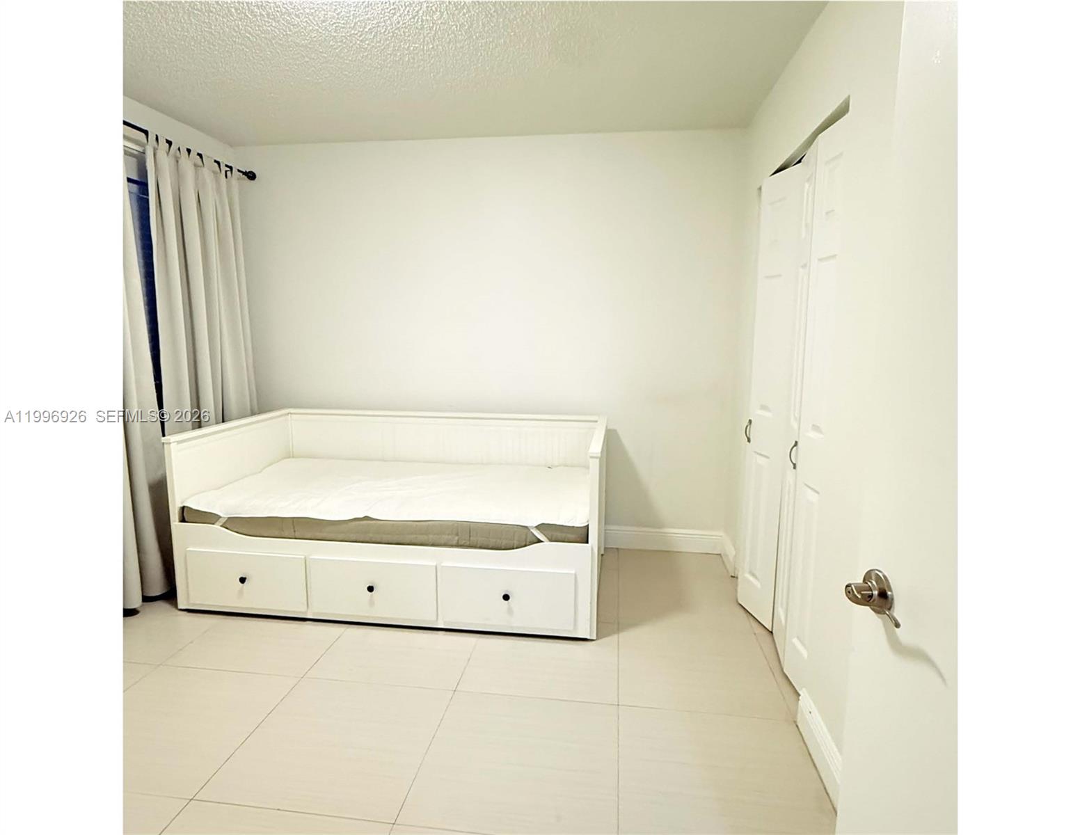 6801 Harding Avenue, Unit 301 Miami Beach, FL 33141 - Photo 3 of 10 a bathroom with a tub a sink and a shower