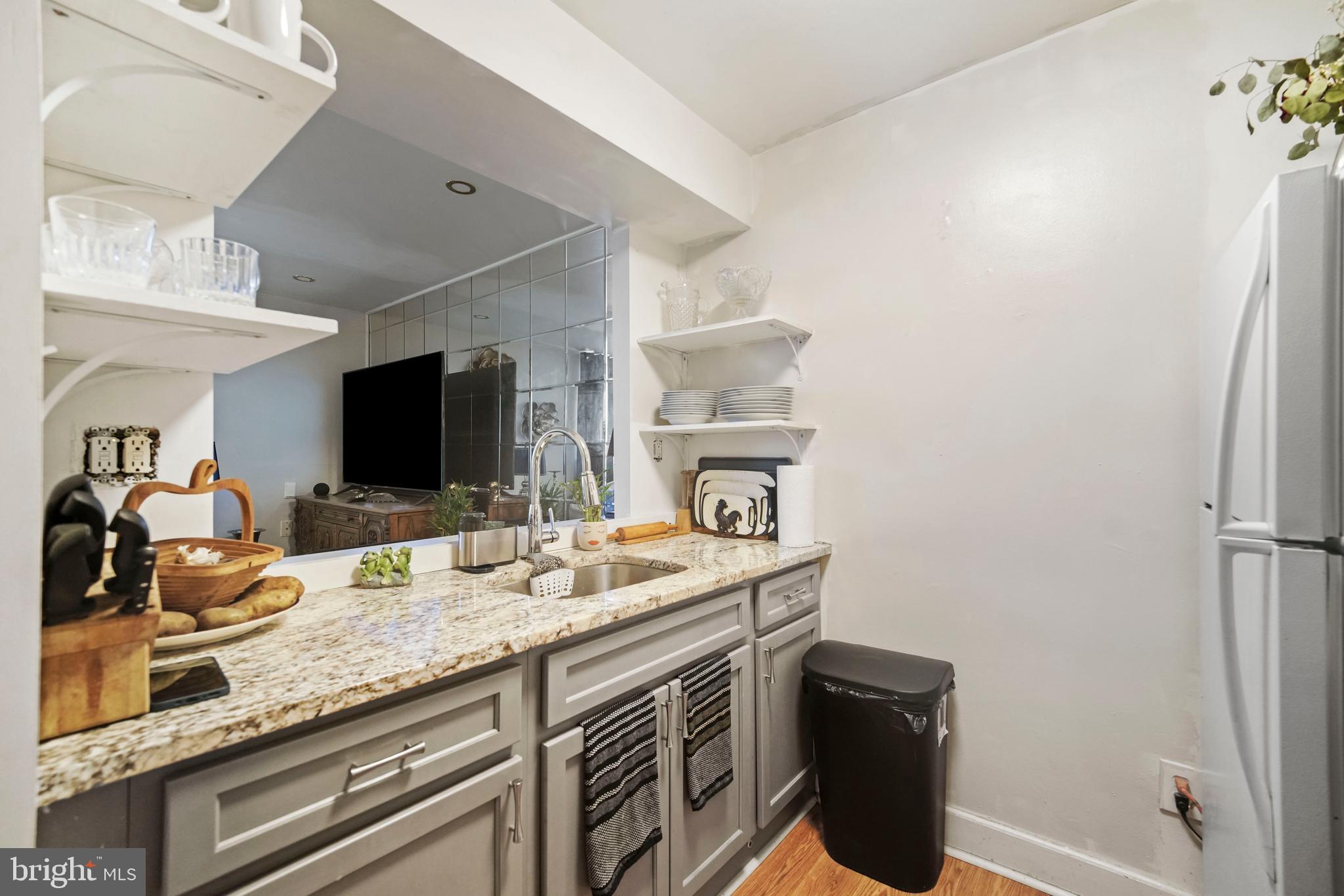 8115 West Chester Pike, Unit A8 Upper Darby, PA 19082 - Photo 11 of 17 a kitchen with a sink appliances and cabinets