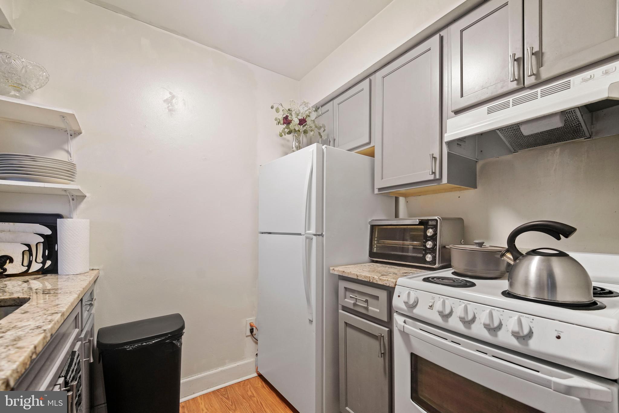 8115 West Chester Pike, Unit A8 Upper Darby, PA 19082 - Photo 13 of 17 a kitchen with appliances cabinets and a counter top space