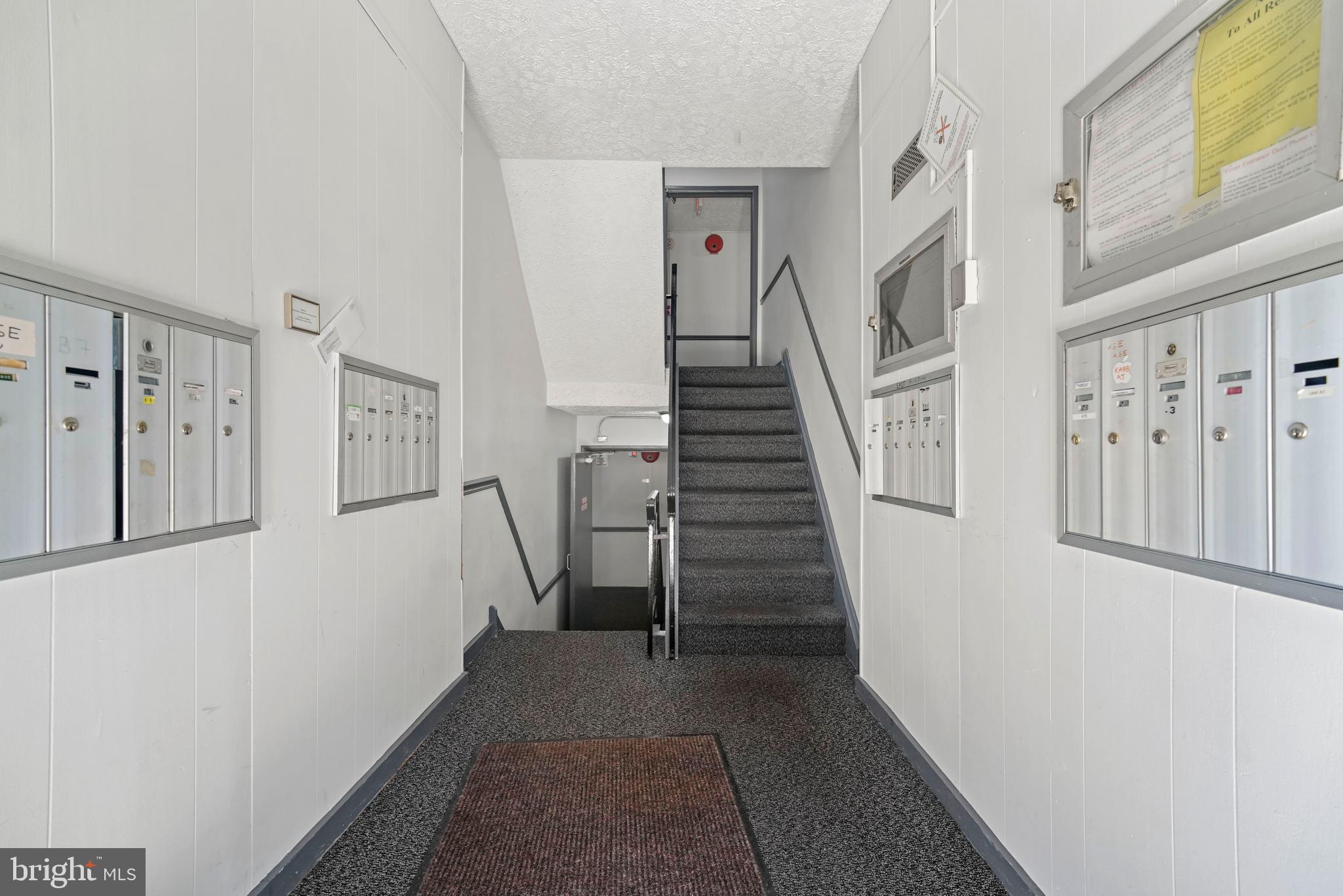 8115 West Chester Pike, Unit A8 Upper Darby, PA 19082 - Photo 5 of 17 a view of a hallway with staircase