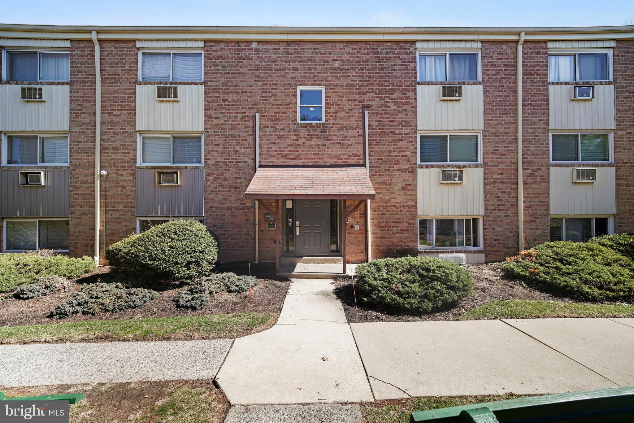 8115 West Chester Pike, Unit A8 Upper Darby, PA 19082 - Photo 5 of 17 a front view of a house with a yard