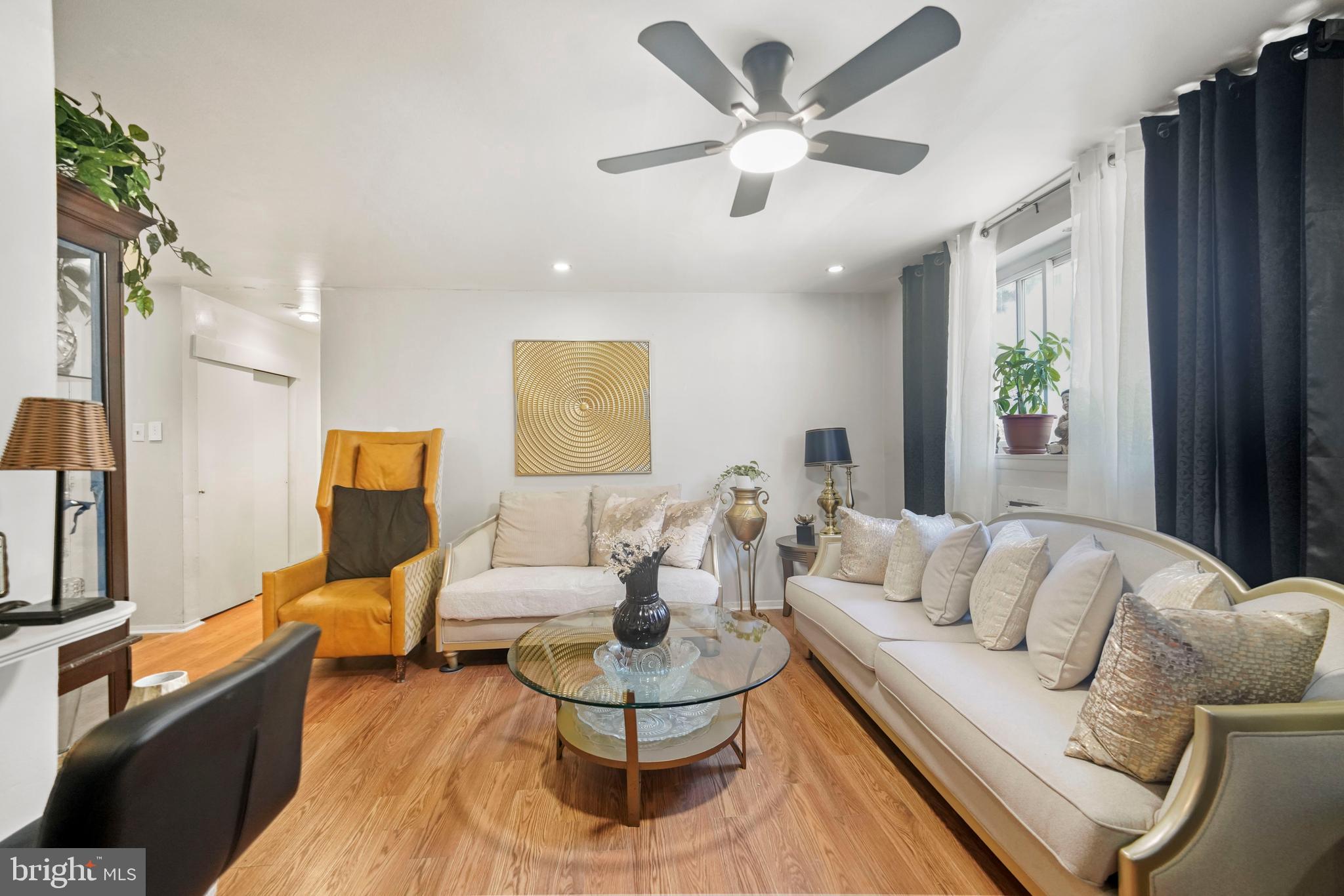 8115 West Chester Pike, Unit A8 Upper Darby, PA 19082 - Photo 9 of 17 a living room with furniture and a large window