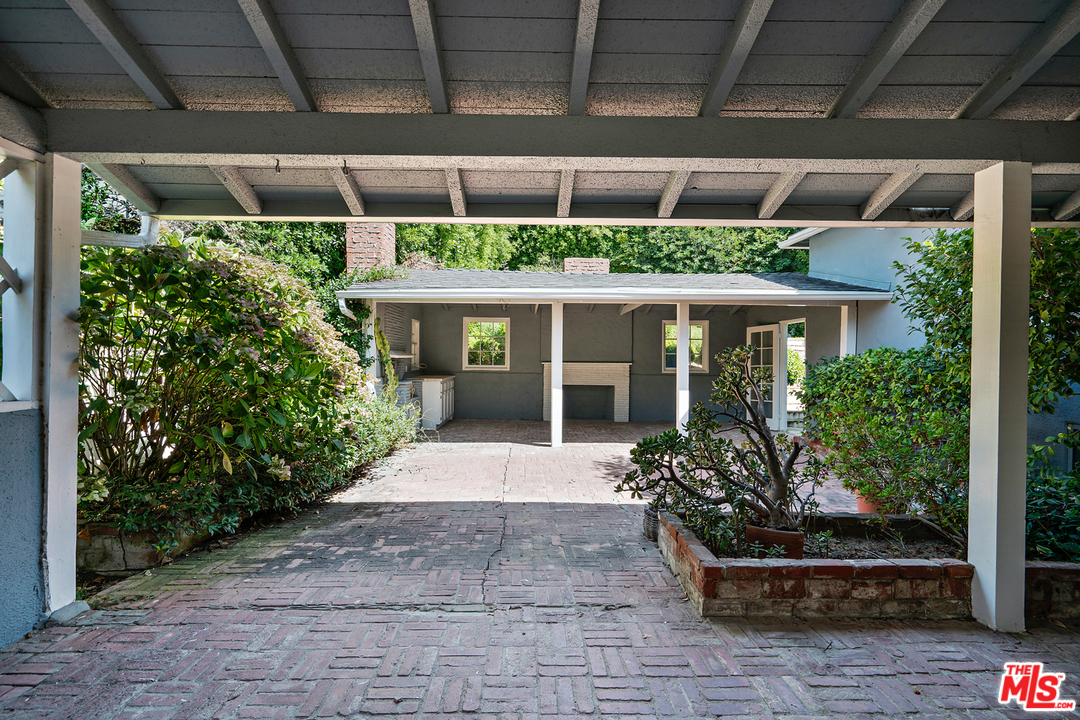 9601 Bolton Road Los Angeles, CA 90034 - Photo 19 of 33 a front view of a house with a porch
