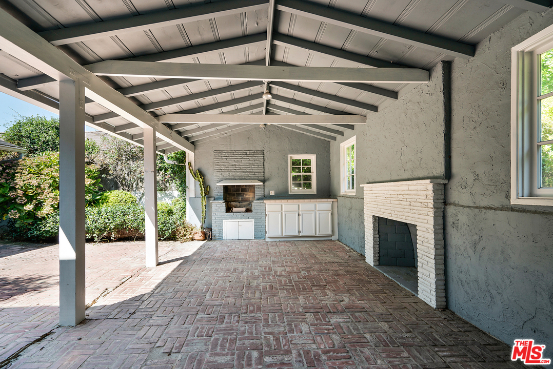 9601 Bolton Road Los Angeles, CA 90034 - Photo 21 of 33 a view of a kitchen with a sink and a fireplace