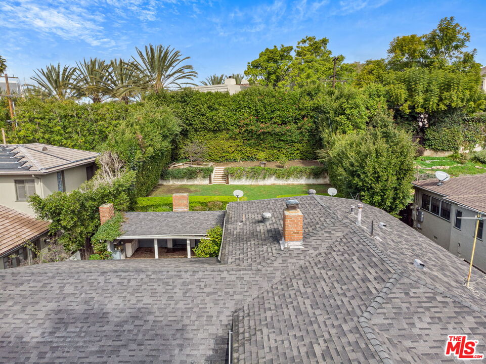 9601 Bolton Road Los Angeles, CA 90034 - Photo 27 of 33 a view of a house with a yard and sitting area