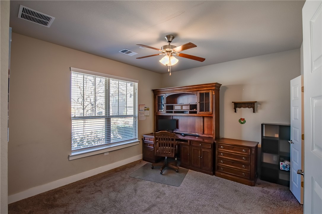 9707 McKnight Loop Austin, TX 78717 - Photo 8 of 17 a view of a workspace with furniture and a window