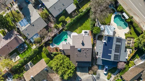 an aerial view of residential houses with outdoor space