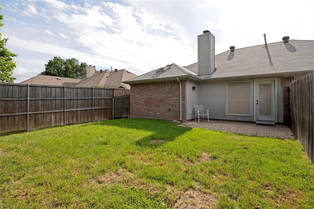8160 Tower Road Frisco, TX 75035 - Photo 22 of 25 a view of a house with backyard and garden