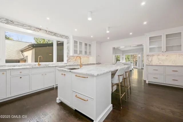 a kitchen with a stove a sink and a refrigerator