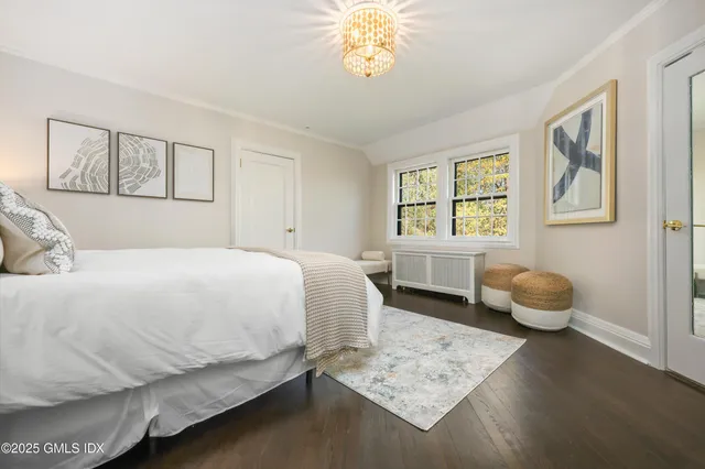 a bedroom with a bed and balcony