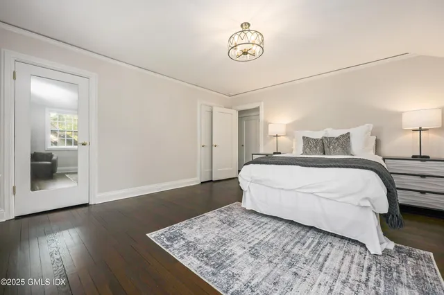 a large white bed in a white room